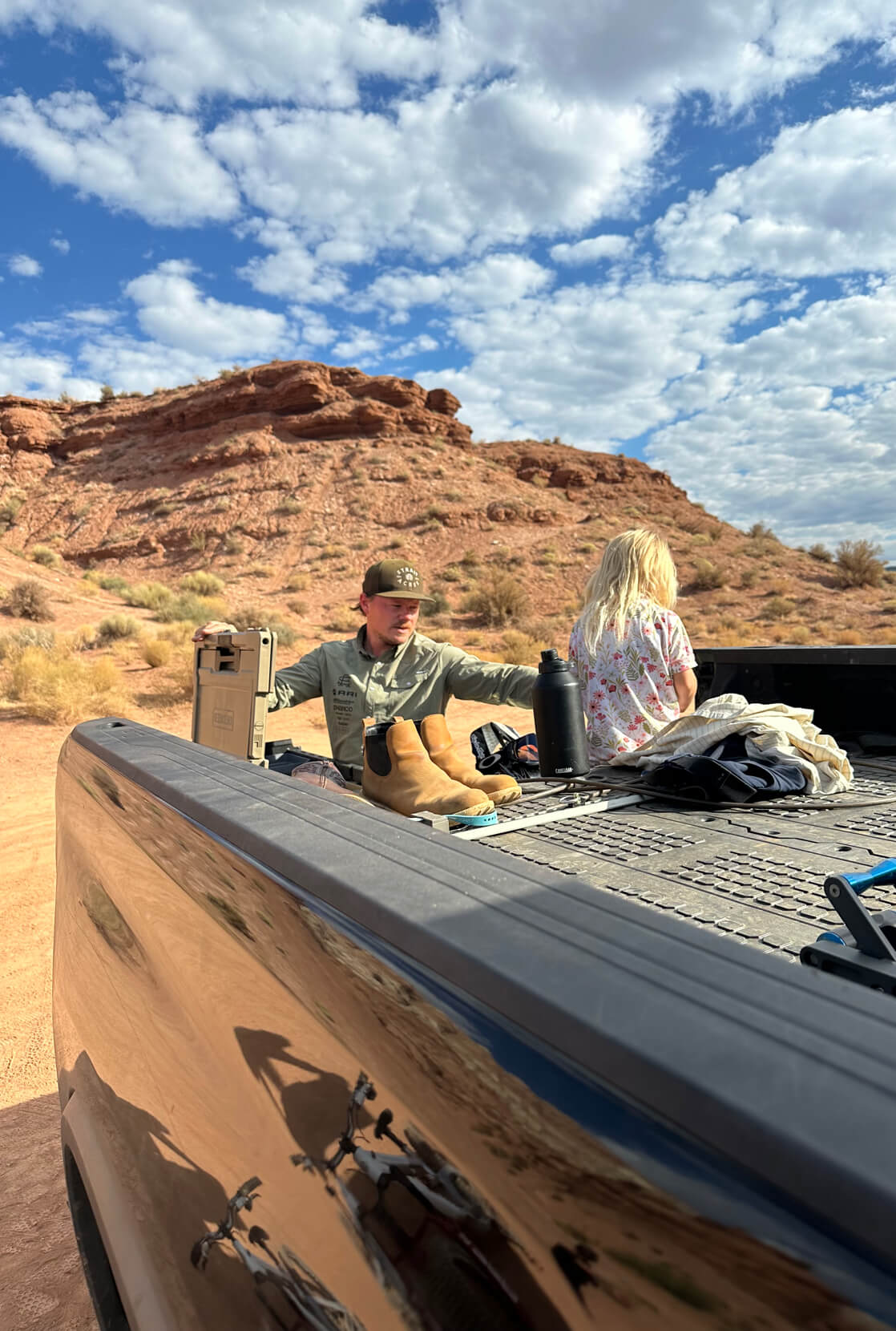 Kyle Strait loading gear into his DECKED Drawer System out in the red rocks