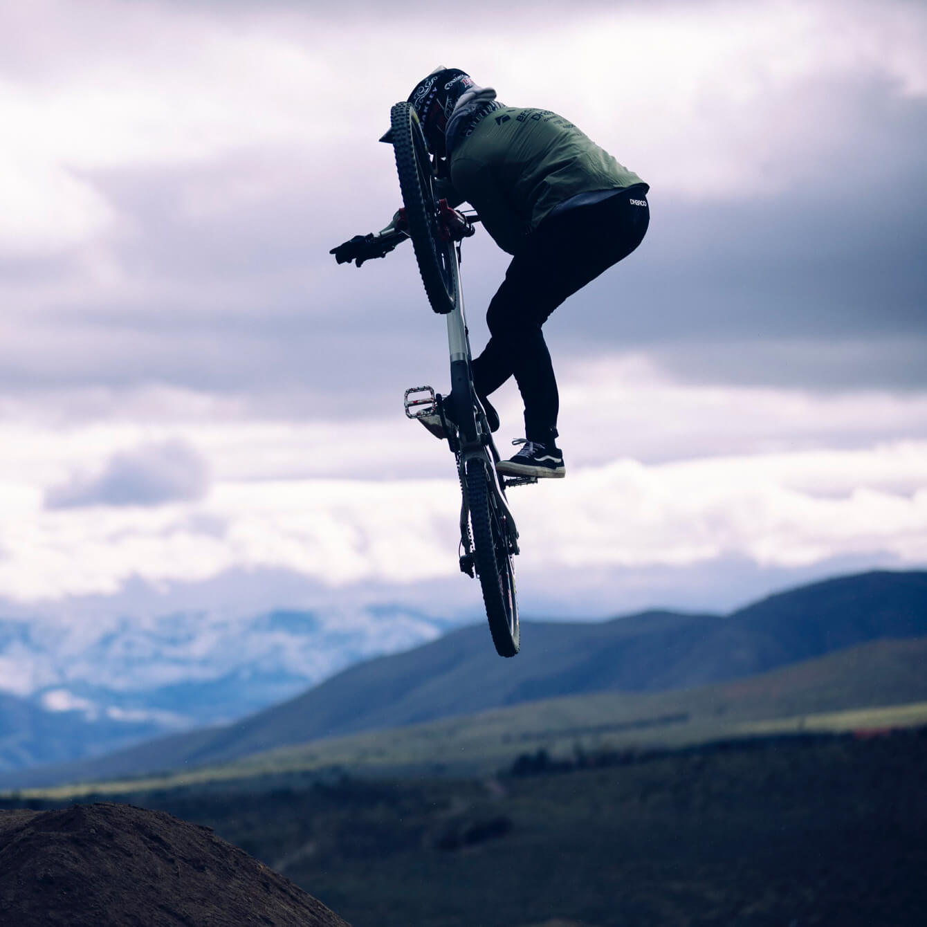 Kyle Strait, midair, performing a trick on his bike.