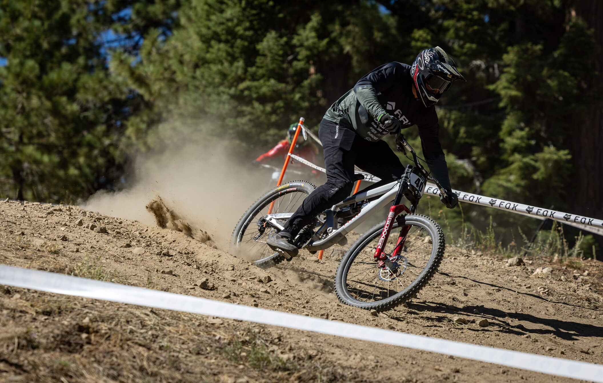 Kyle Strait banking a corner on his bike during a race.