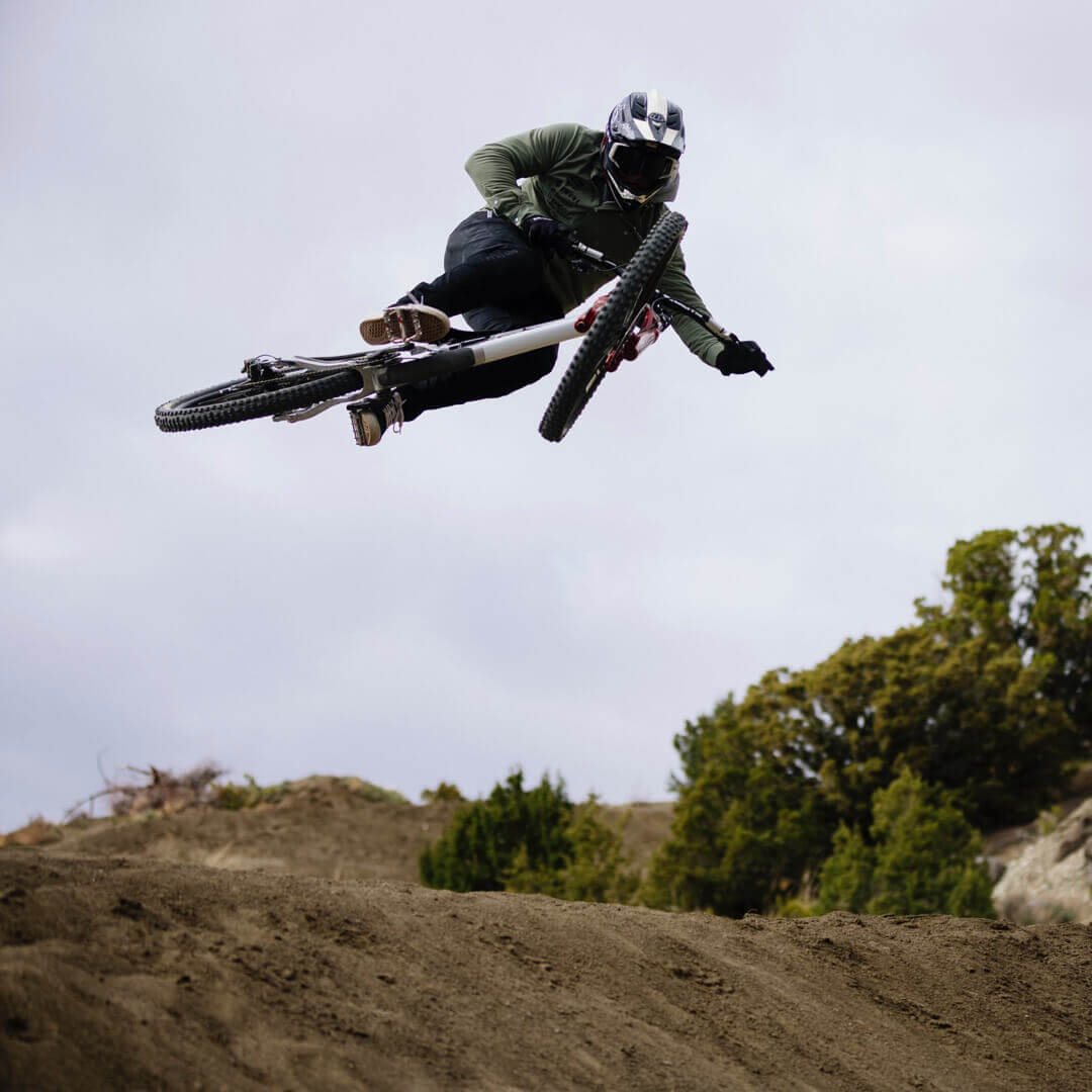 Kyle Strait midair on his bike coming off of a jump.