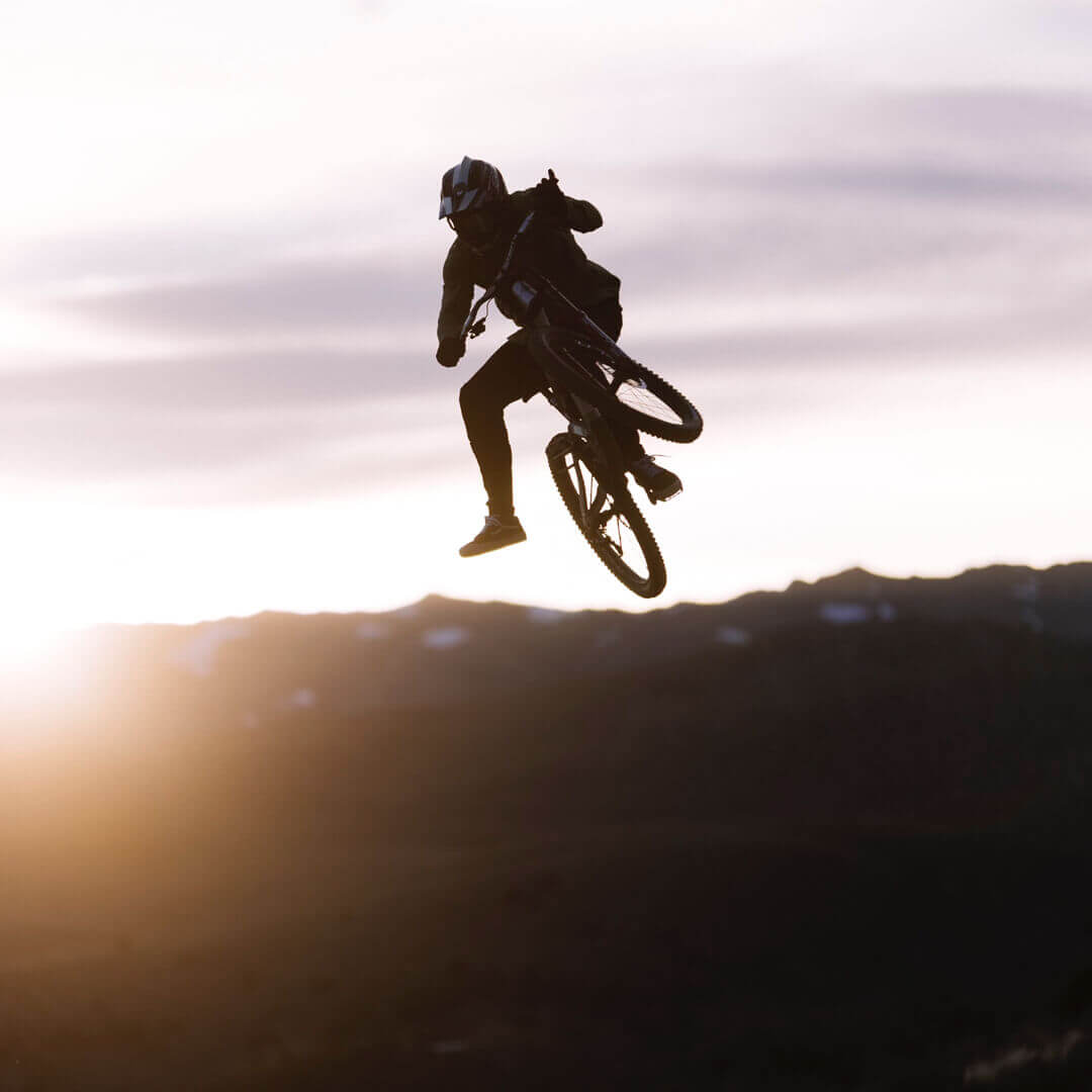 Kyle Strait performing a trick on his bike.