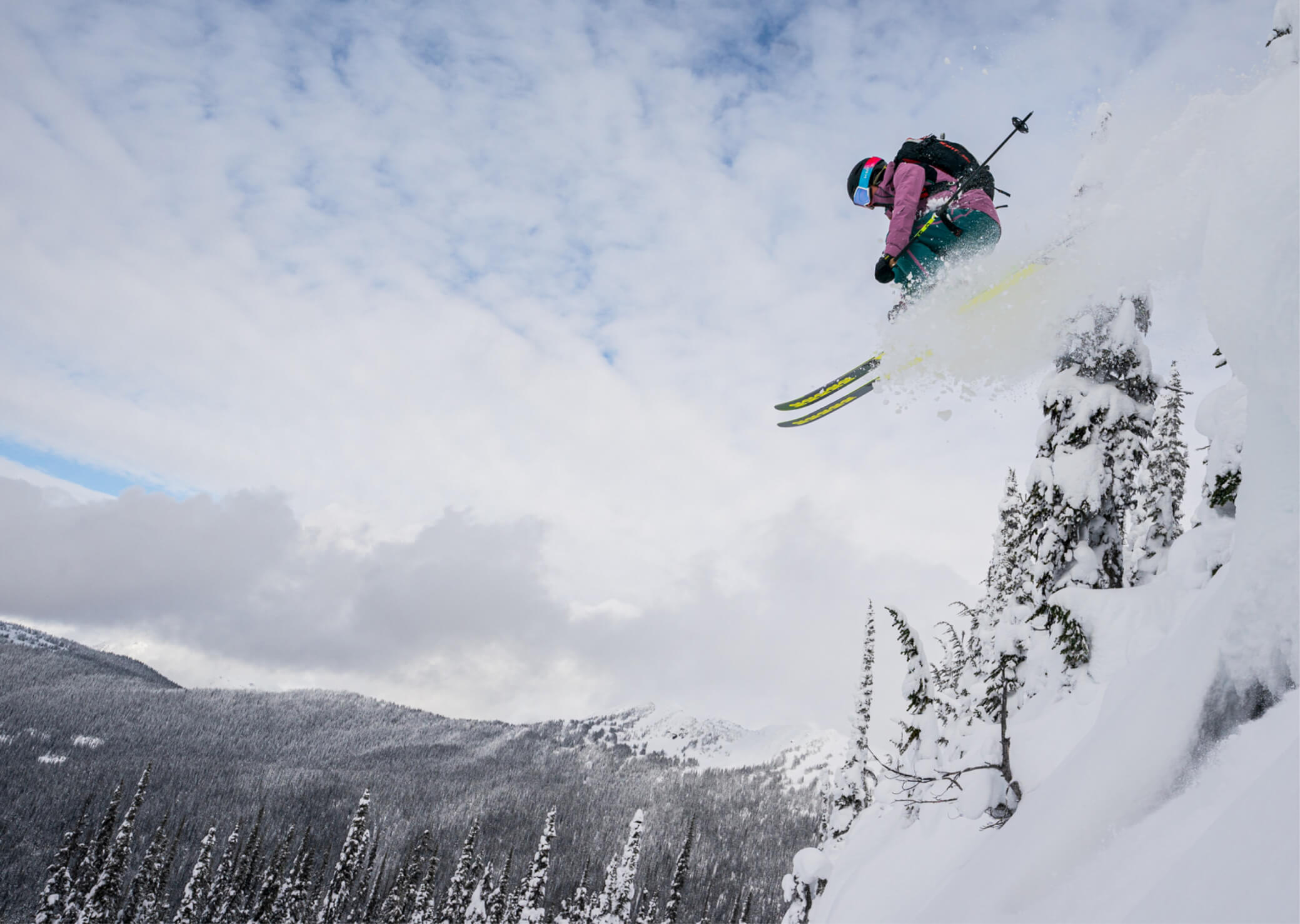 McKenna Peterson sending it off a cliff while backcountry skiing.
