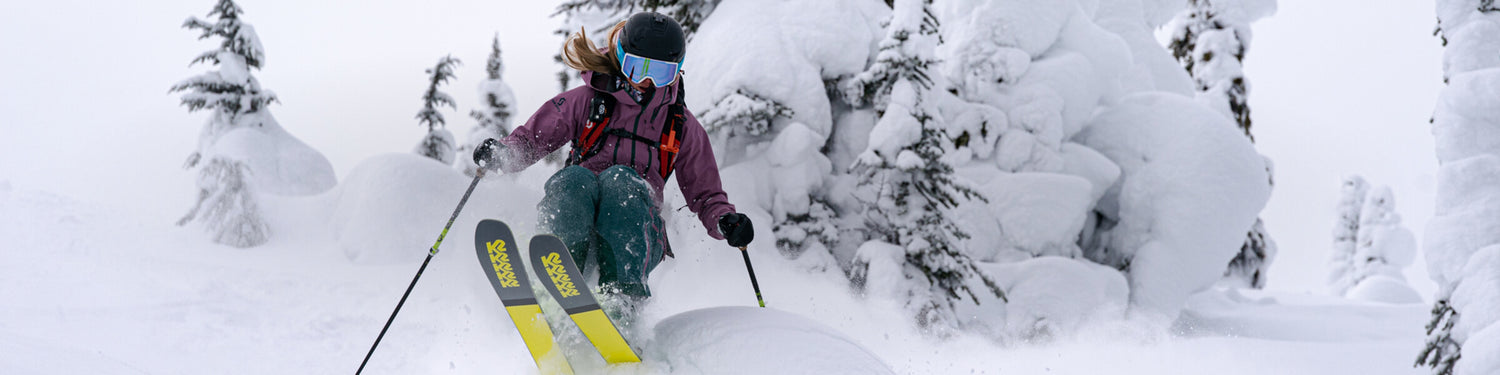 McKenna skiing powder in the backcountry.