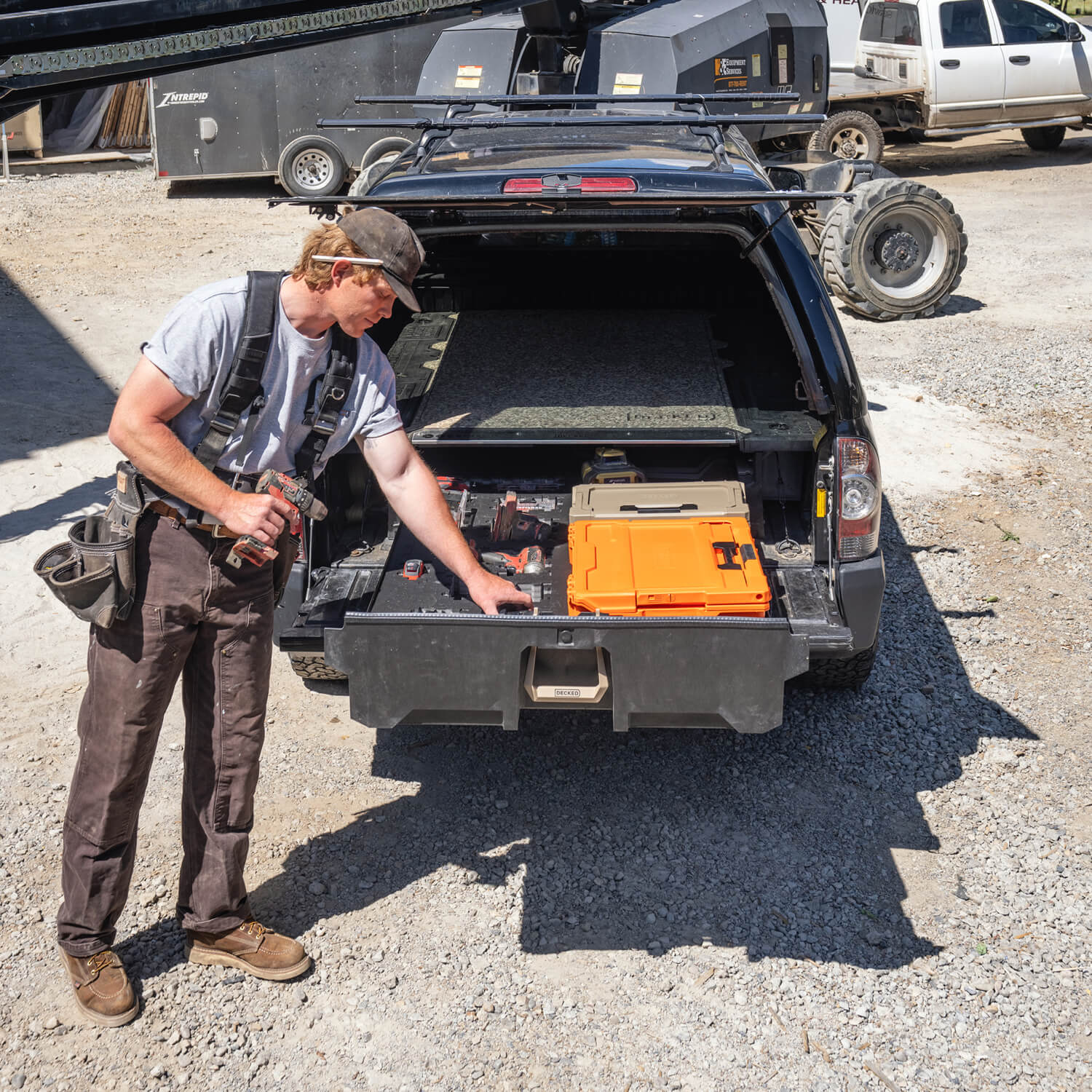 A man unloading tools from a Drawer System at a job-site.