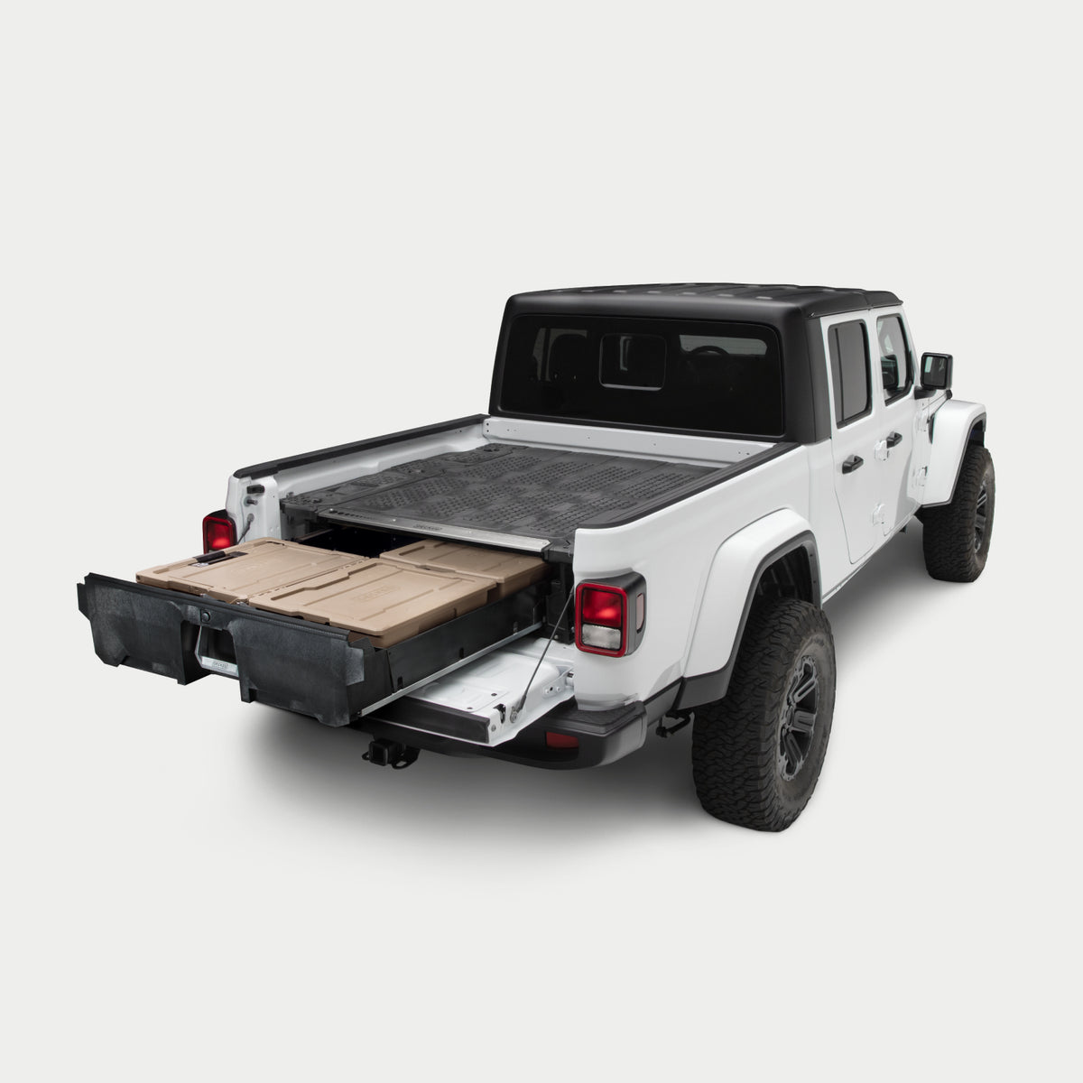 Angled image of a midsize truck with a Drawer System in the bed with its drawer fully extended.