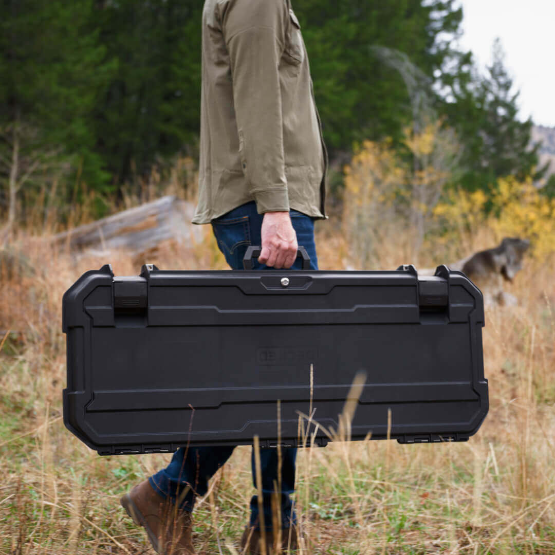 A man carrying his black Honcho