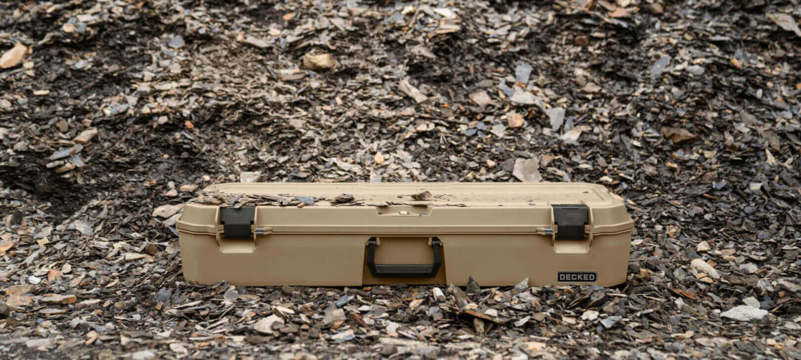 A Desert Tan Honcho sitting in gravel