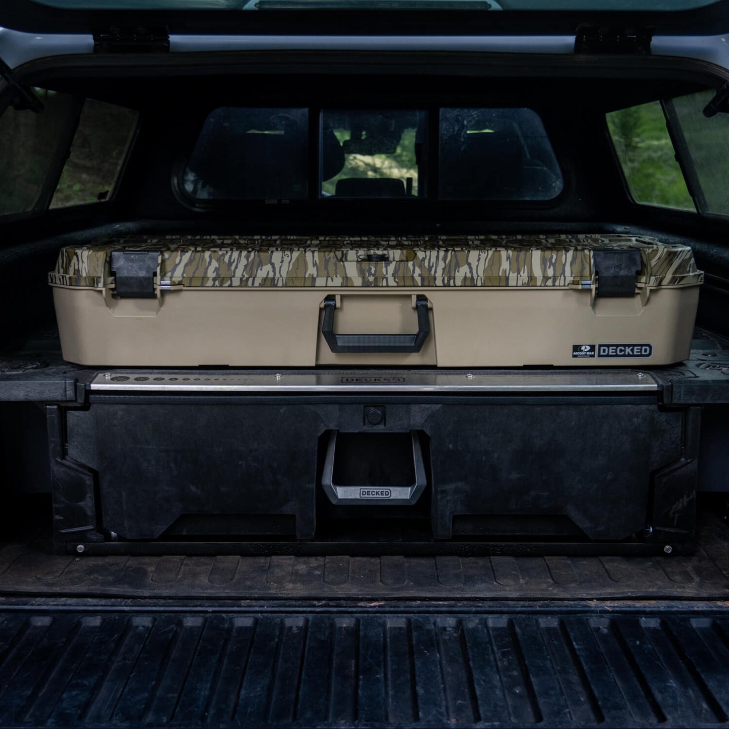 A Mossy Oak Honcho sitting on top of a DECKED Drawer System.