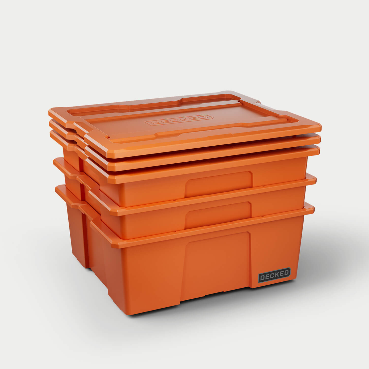 Three blaze orange Payloader bins nested together with the three lids stacked on top.