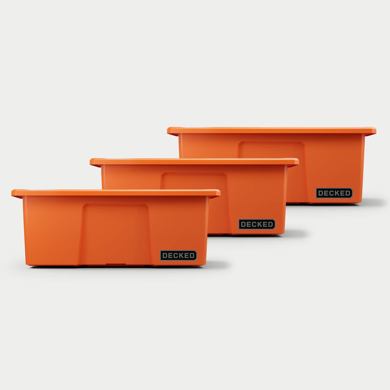 Three blaze orange Payloader bins, closed on a white background, staggered diagonally.