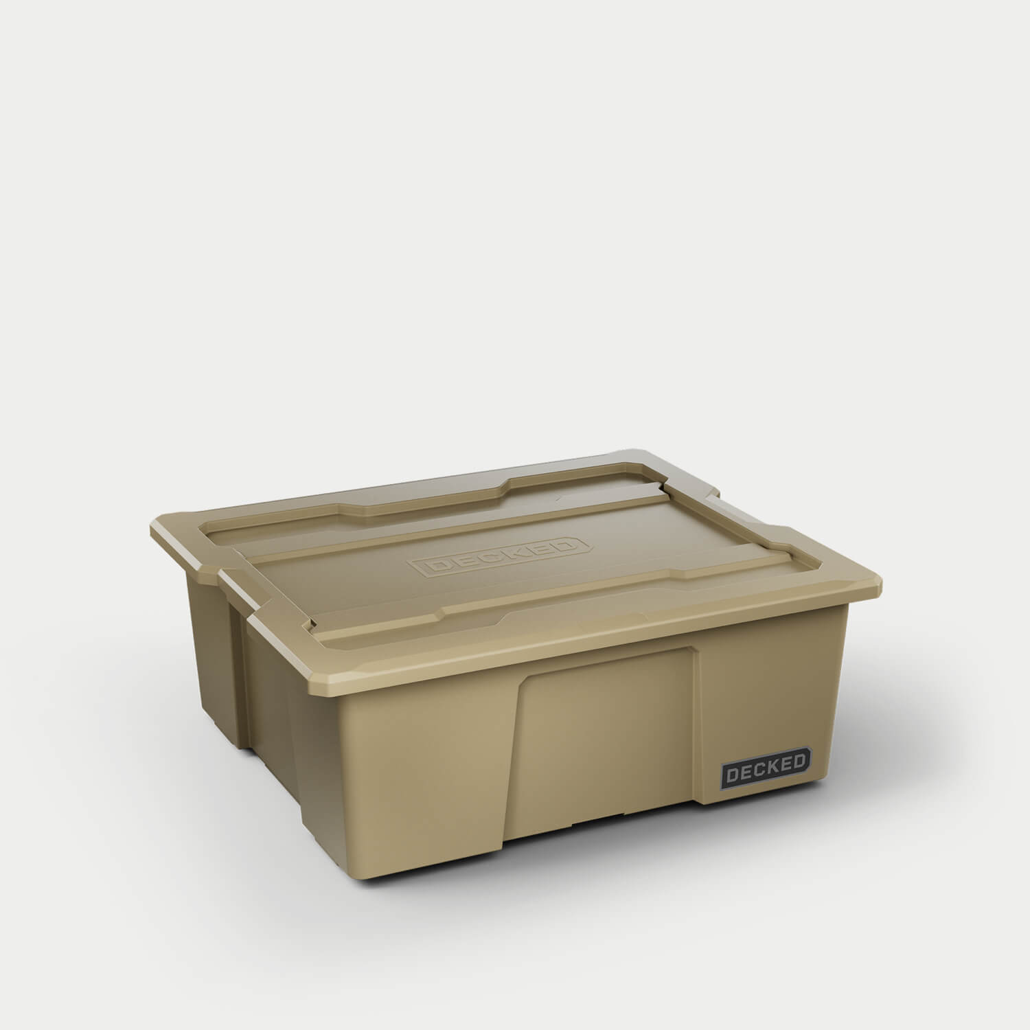 One desert tan Payloader bin, closed on a white background with a DECKED logo in the bottom right hand corner of the bin.