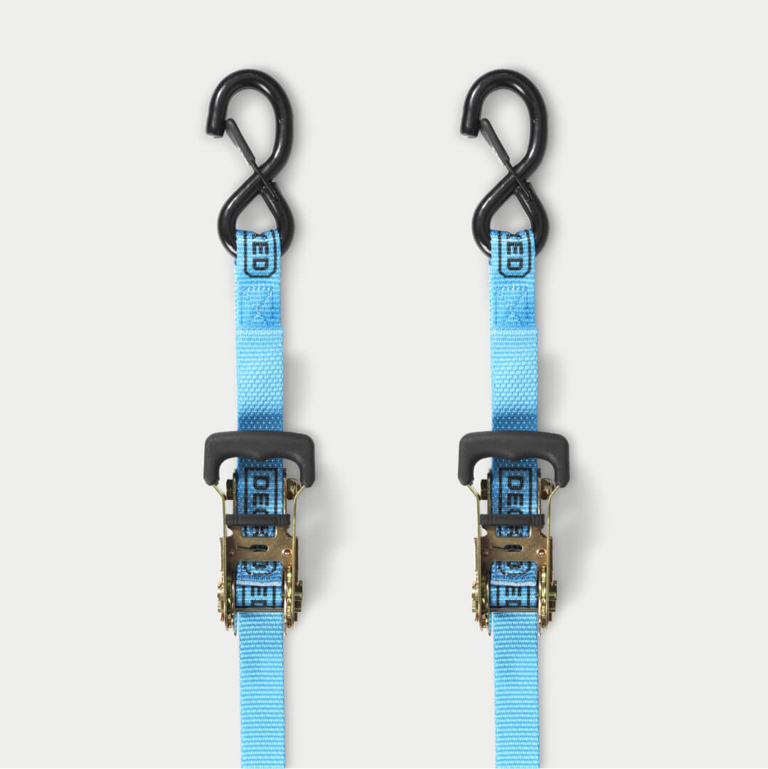 Two blue ratchet straps on a grey background