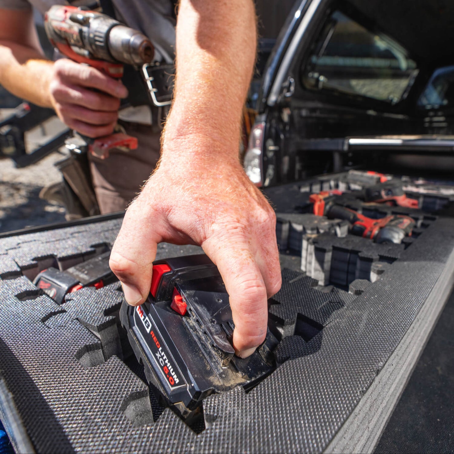 A close up of power tools organized into compartments in the Piecekeeper PuzzleFoam.