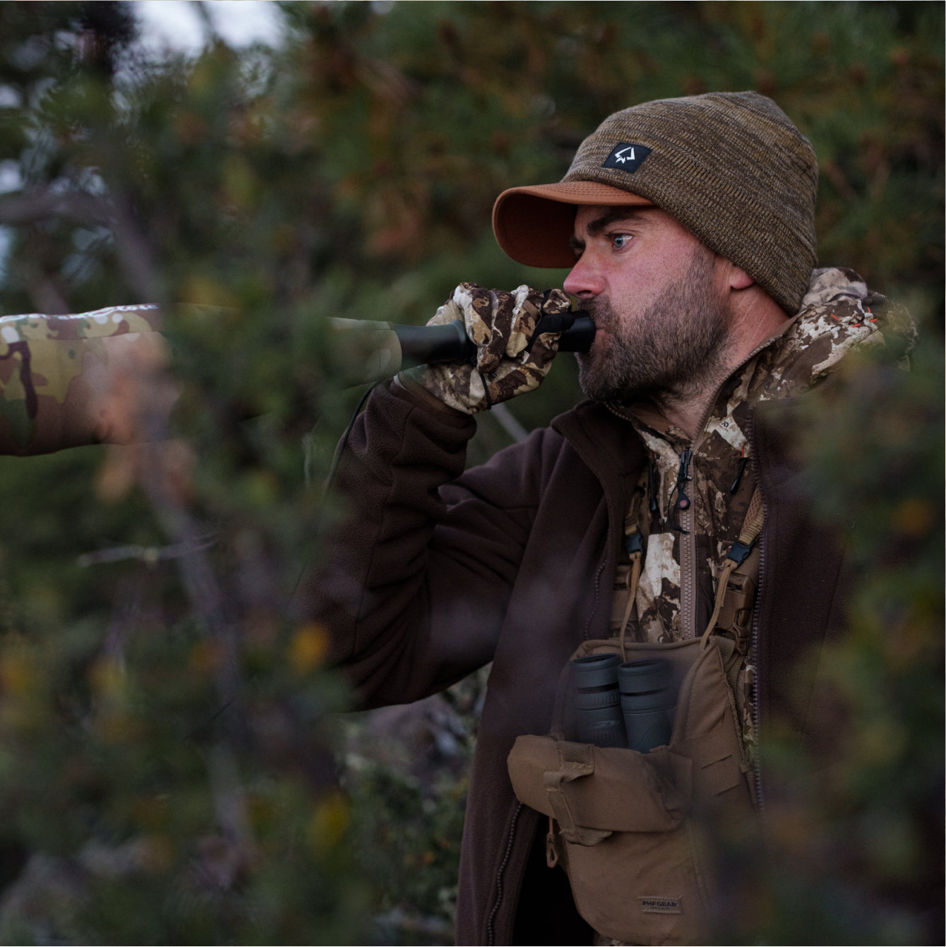 Remi Warren bugling in the woods while looking for elk.