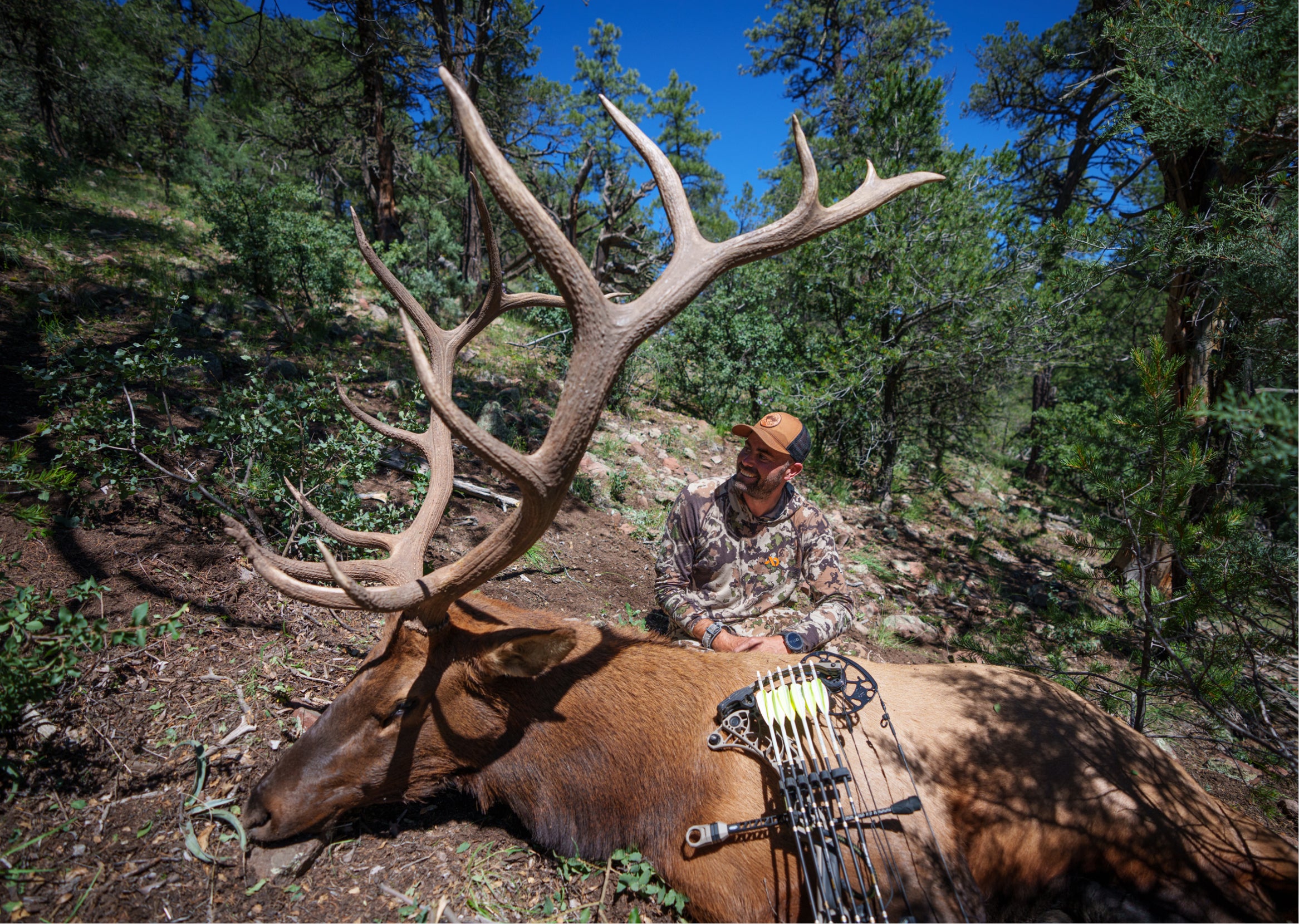 Remi Warren smiling with his archery bull.