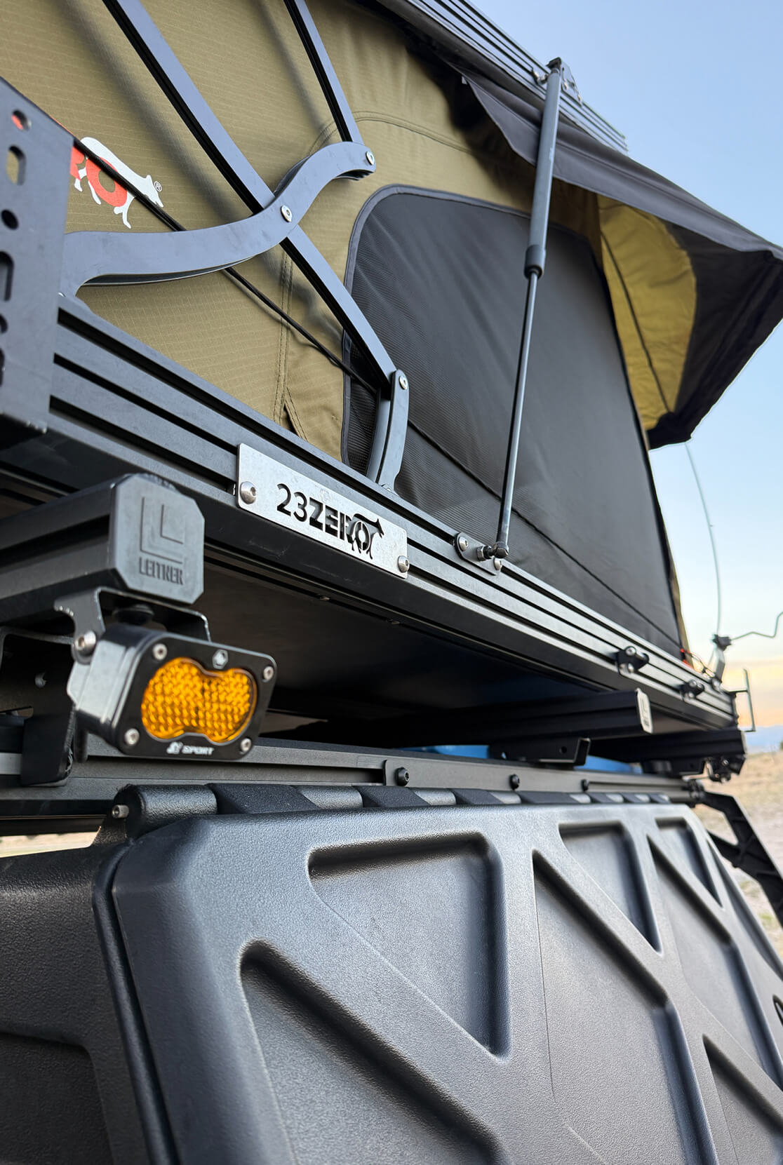 Roof rack system on a vehicle with visible brand logo
