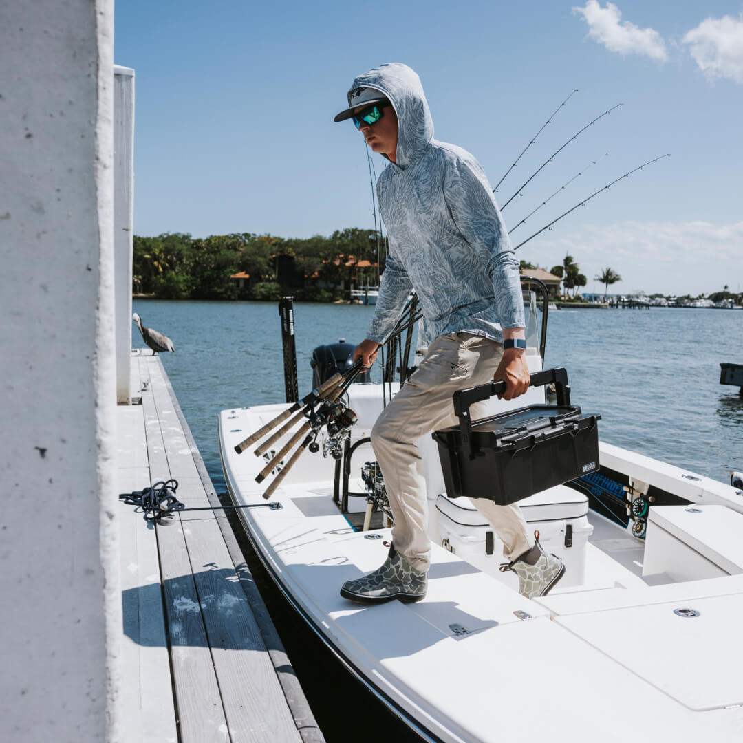 Black sixer being carried off of a fishing boat.