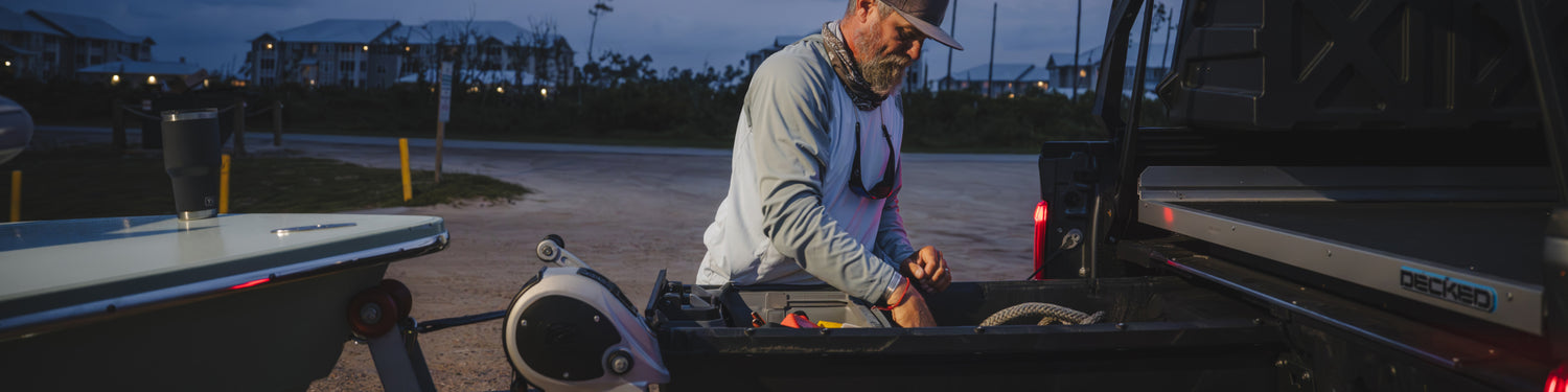 David Mangum retrieving fishing gear from his DECKED Drawer System.