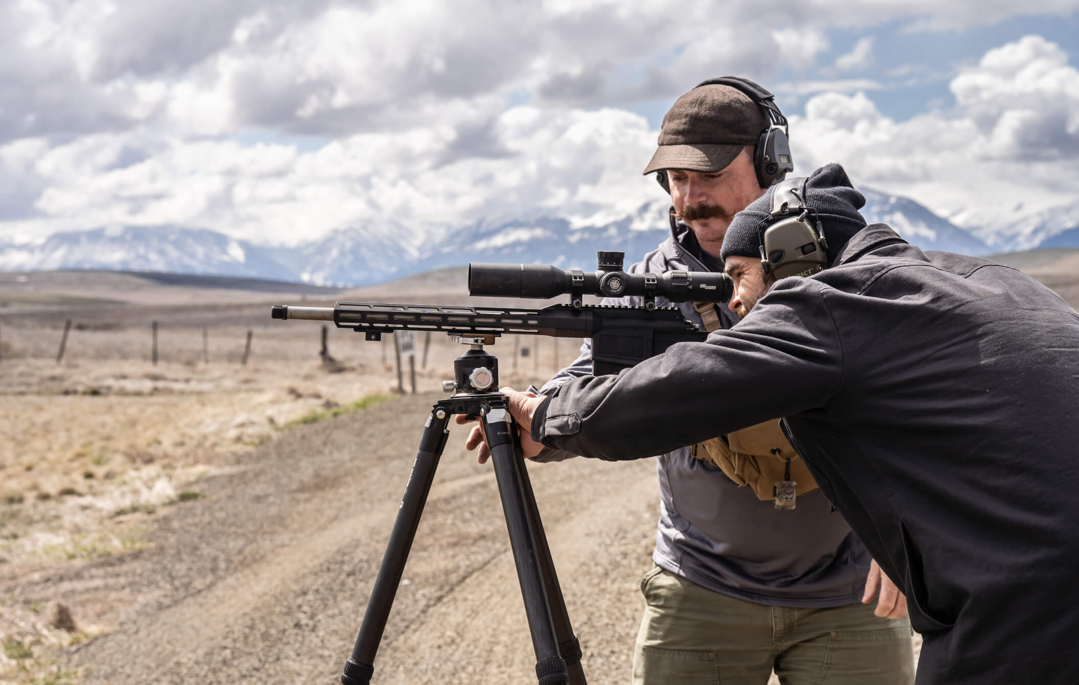 James Nash instructing someone at the range.