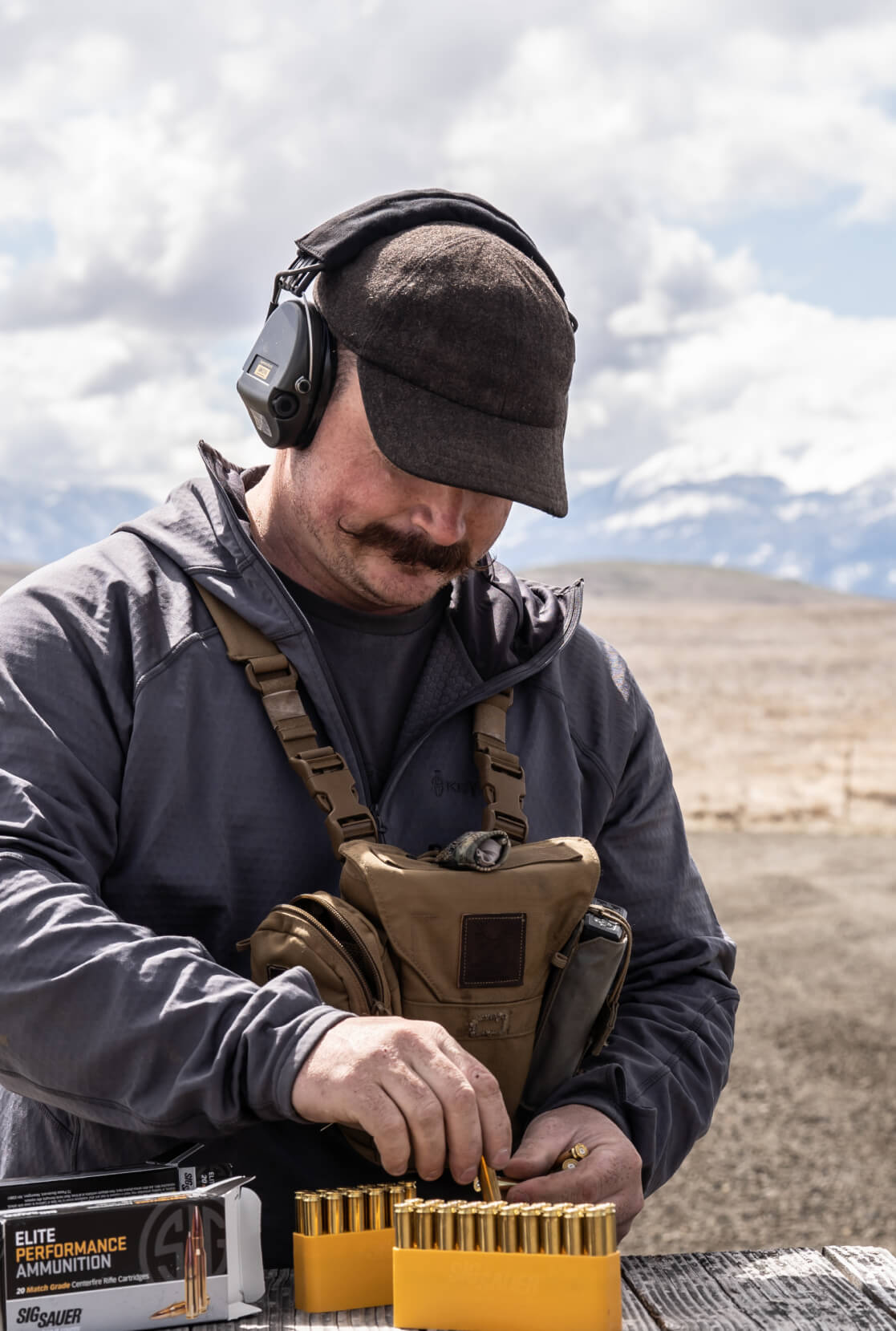 James Nash sorting bullets at the range.