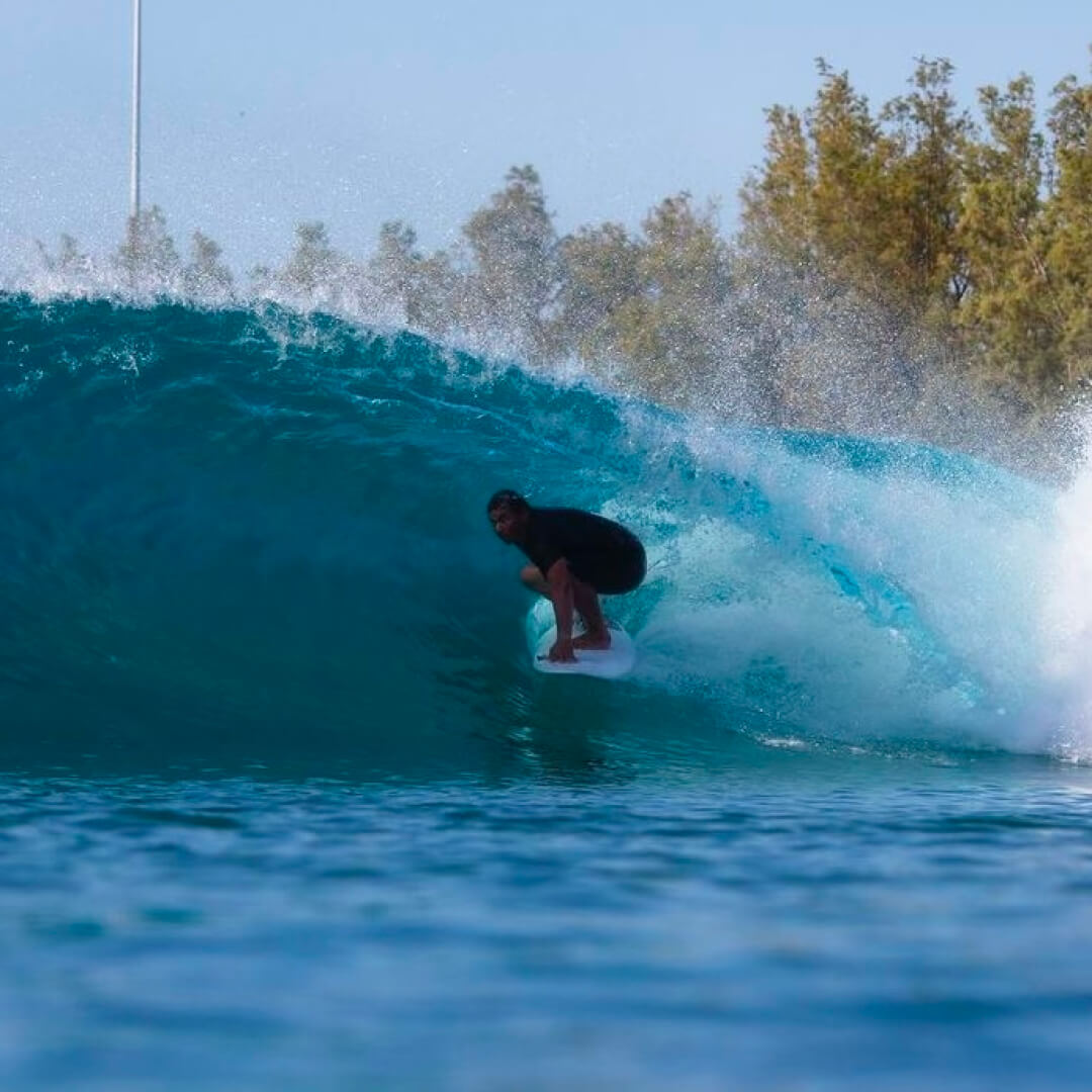 Justin Lee surfing the tunnel of a wave in Hawaii.