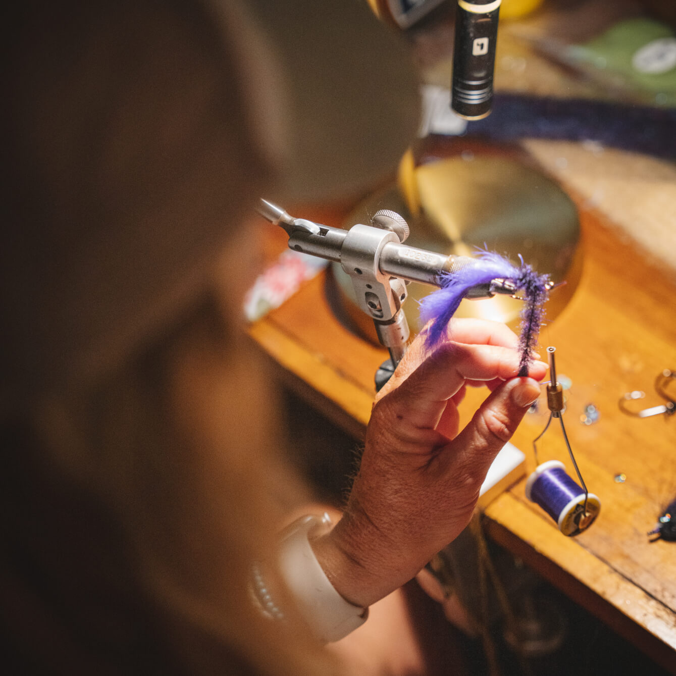 Lacey Kelly tying flies at her home in Florida.