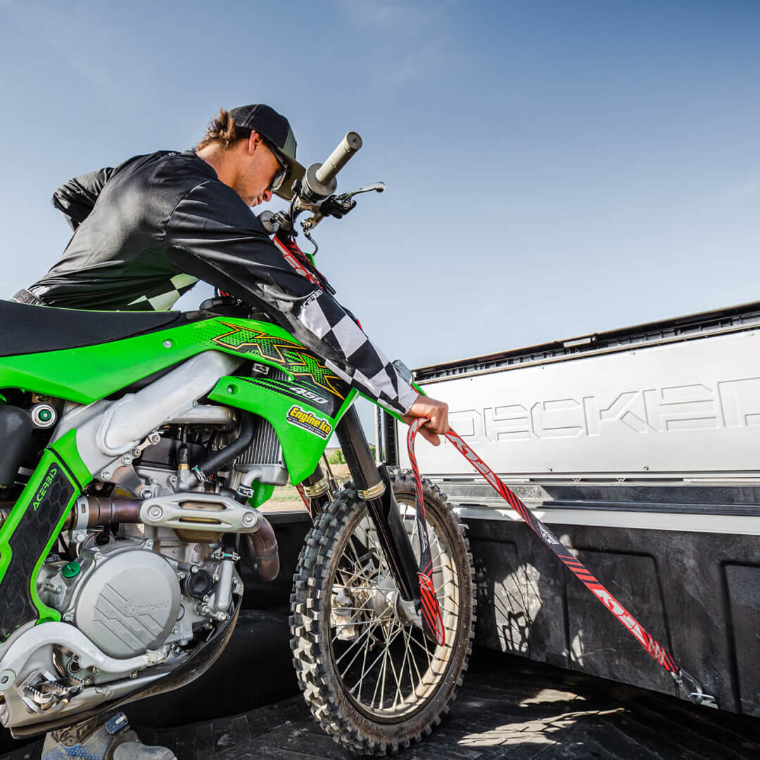 Tool Box Tie downs being used to secure a Dirt Bike to a truck
