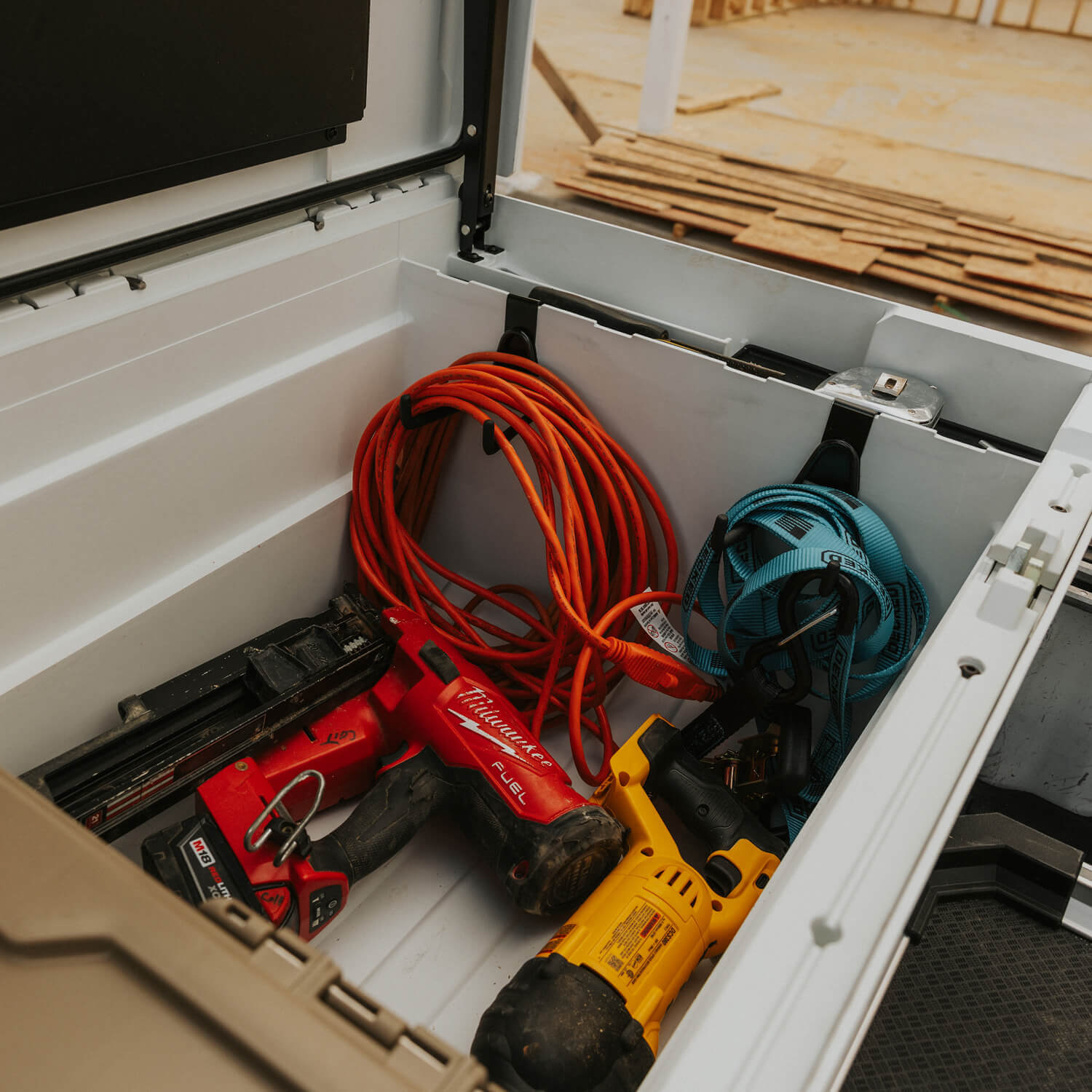 An open white DECKED Tool Box loaded with tools on tool hooks.