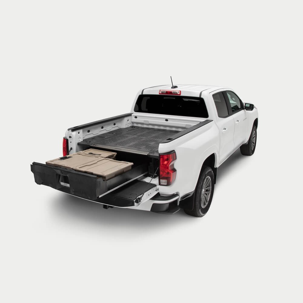 A midsize truck with a Drawer System extended in the bed.