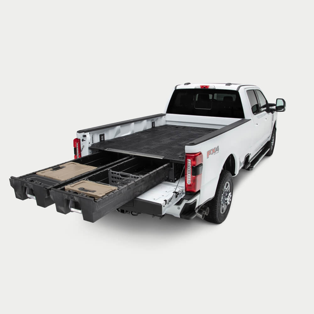 A full-size, 8ft bed truck with a Drawer System extended in the bed.