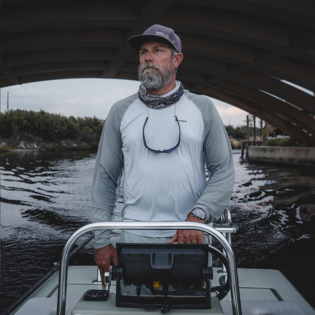 David Mangum at the helm of his boat.