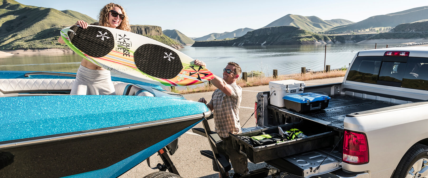 truck pulling a surfing boat and a drawer system storing boating gear