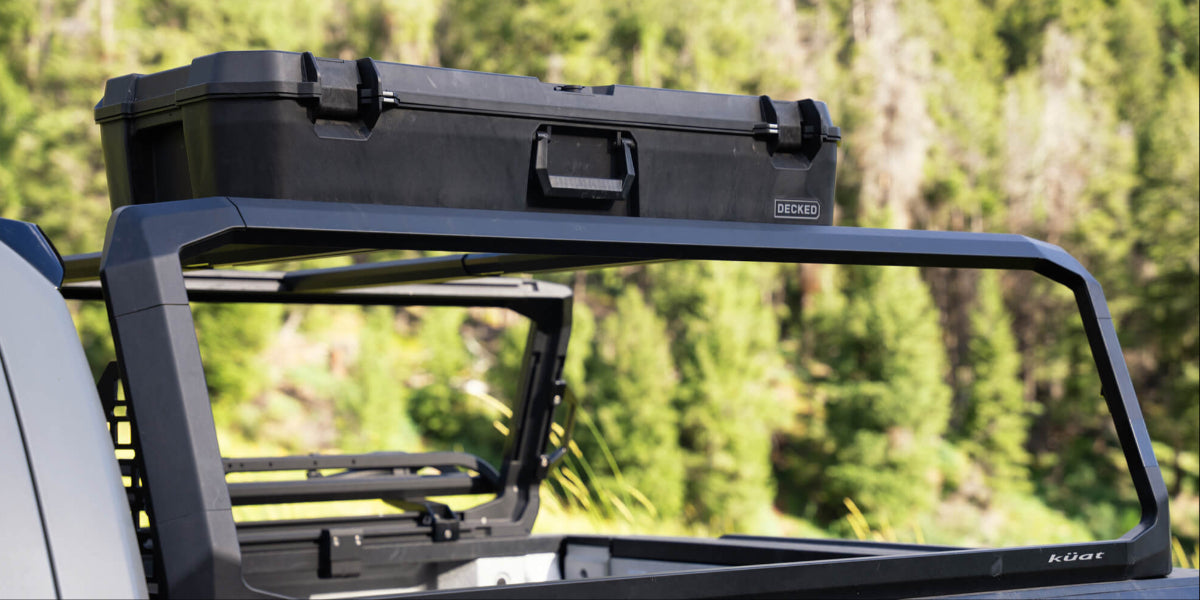 A black Honcho D-co Case mounted to a Kuat Roof Rack.