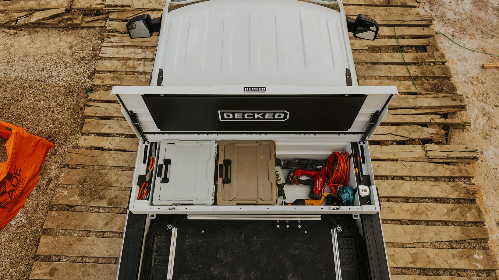Open DECKED tool box with DECKED halfracks and tools loaded inside.
