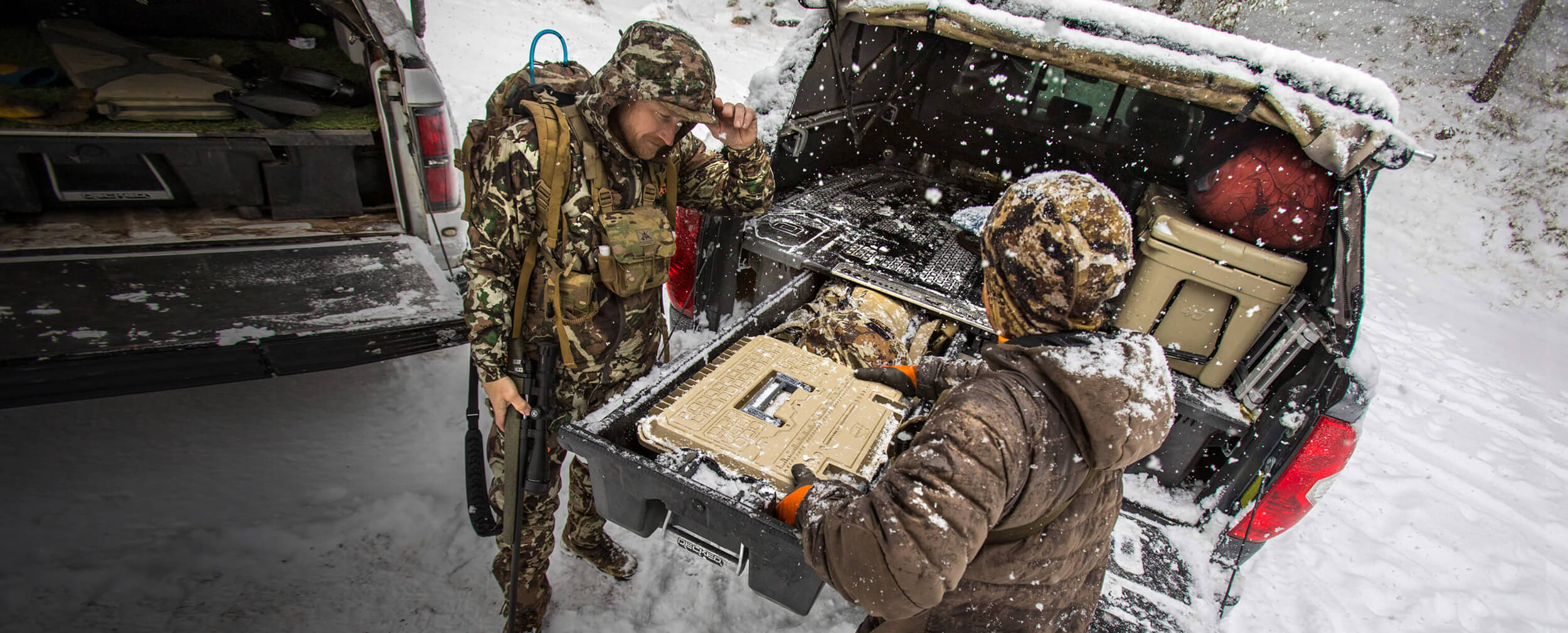 hunters grabbing a d box out of their decked drawer system