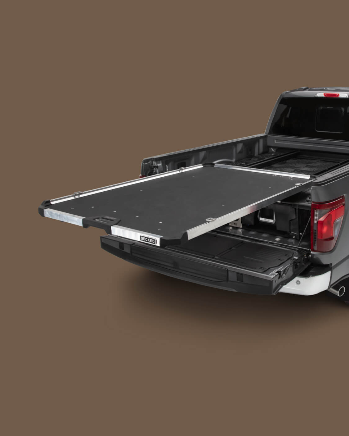 A fully extended CargoGlide mounted on a Drawer System in a full-size truck bed.