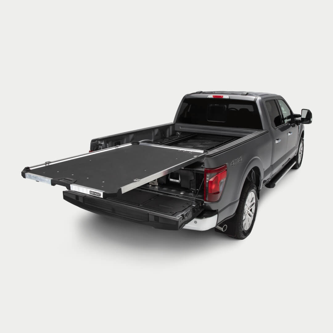 [DCG1000-6348, DCG1000-7348] A studio shot of a fully extended CargoGlide mounted on a Drawer System in a full-size truck bed.