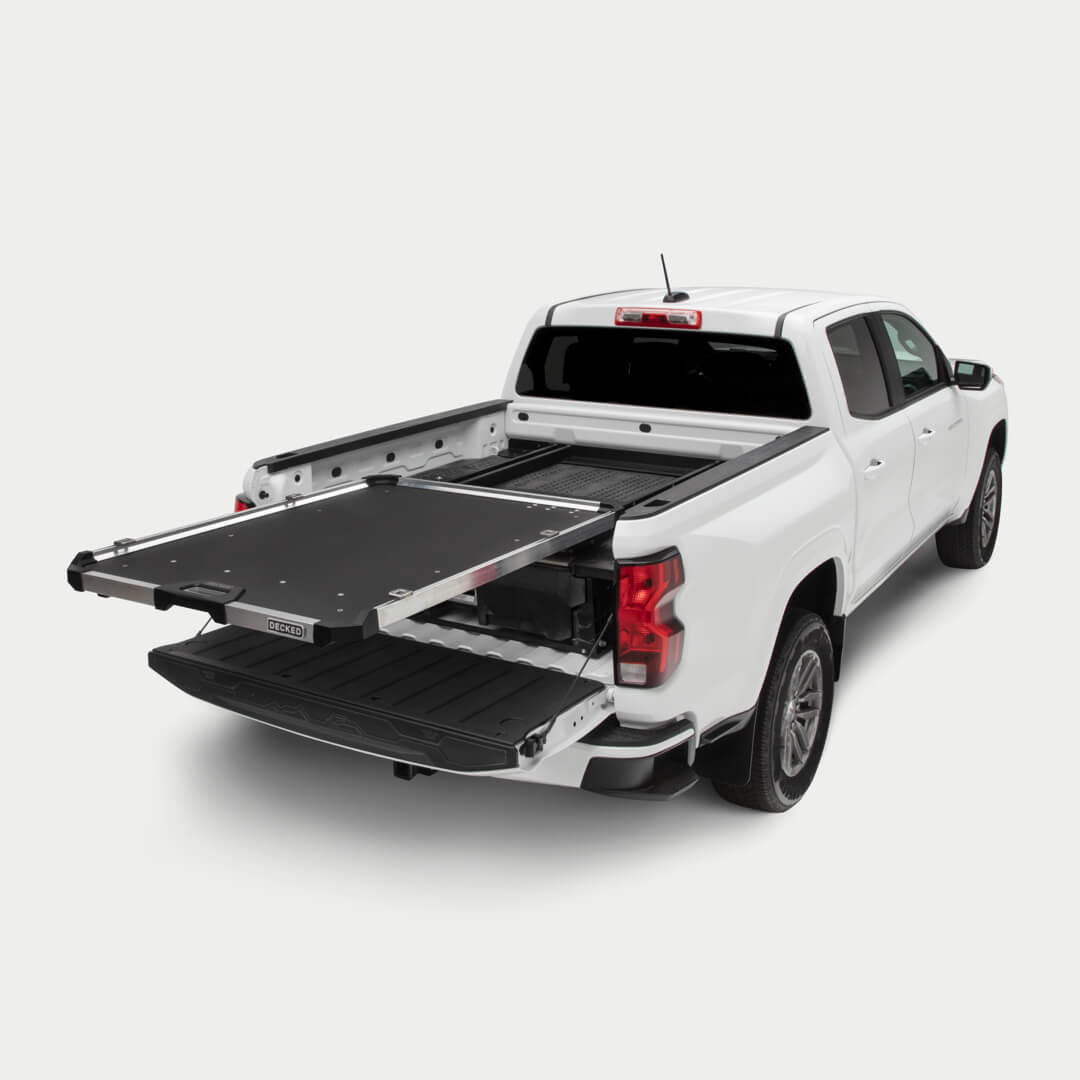 A studio shot of a fully extended CargoGlide mounted on a Drawer System in a midsize truck bed.