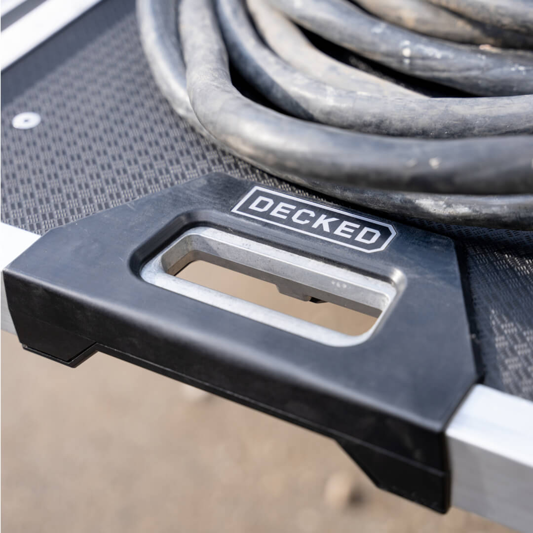 A close up of the CargoGlide 600's new grip-release handle to extend the system from the truck bed.