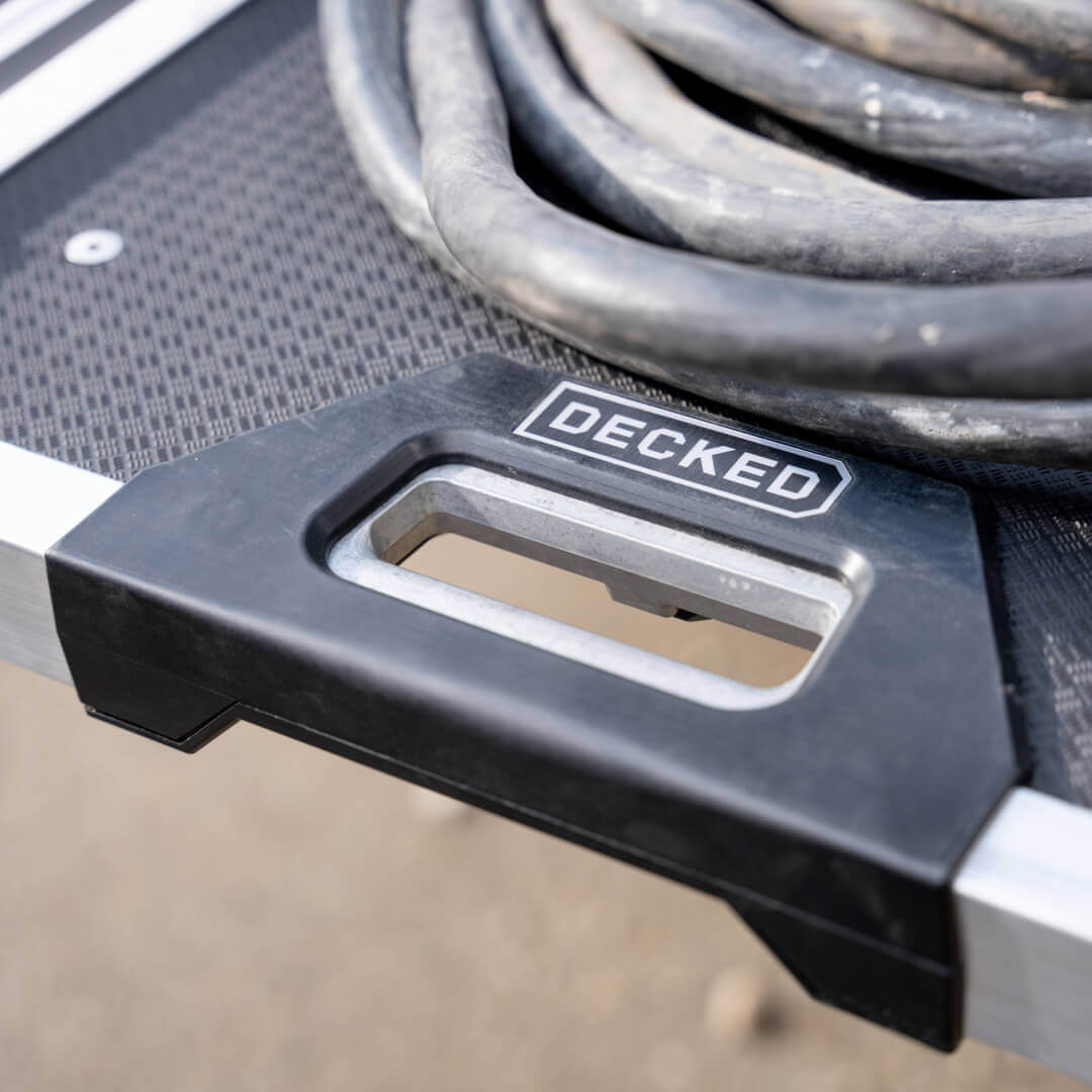 A close up of the CargoGlide's new grip-release handle used to extend the system from the truck bed.