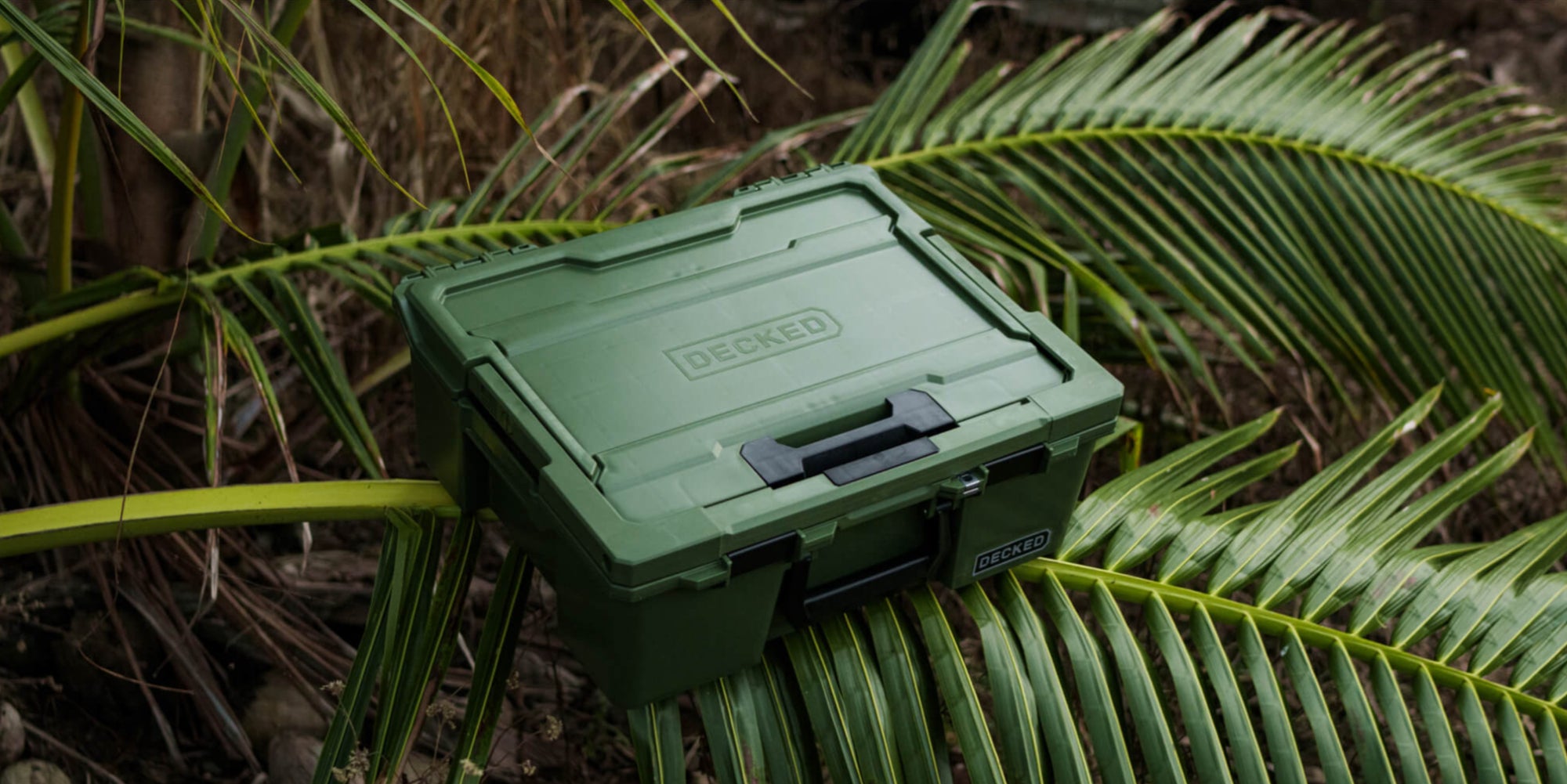 The Ranger Green Halfrack sitting on top of a palm frond, the image screams Ranger Green.