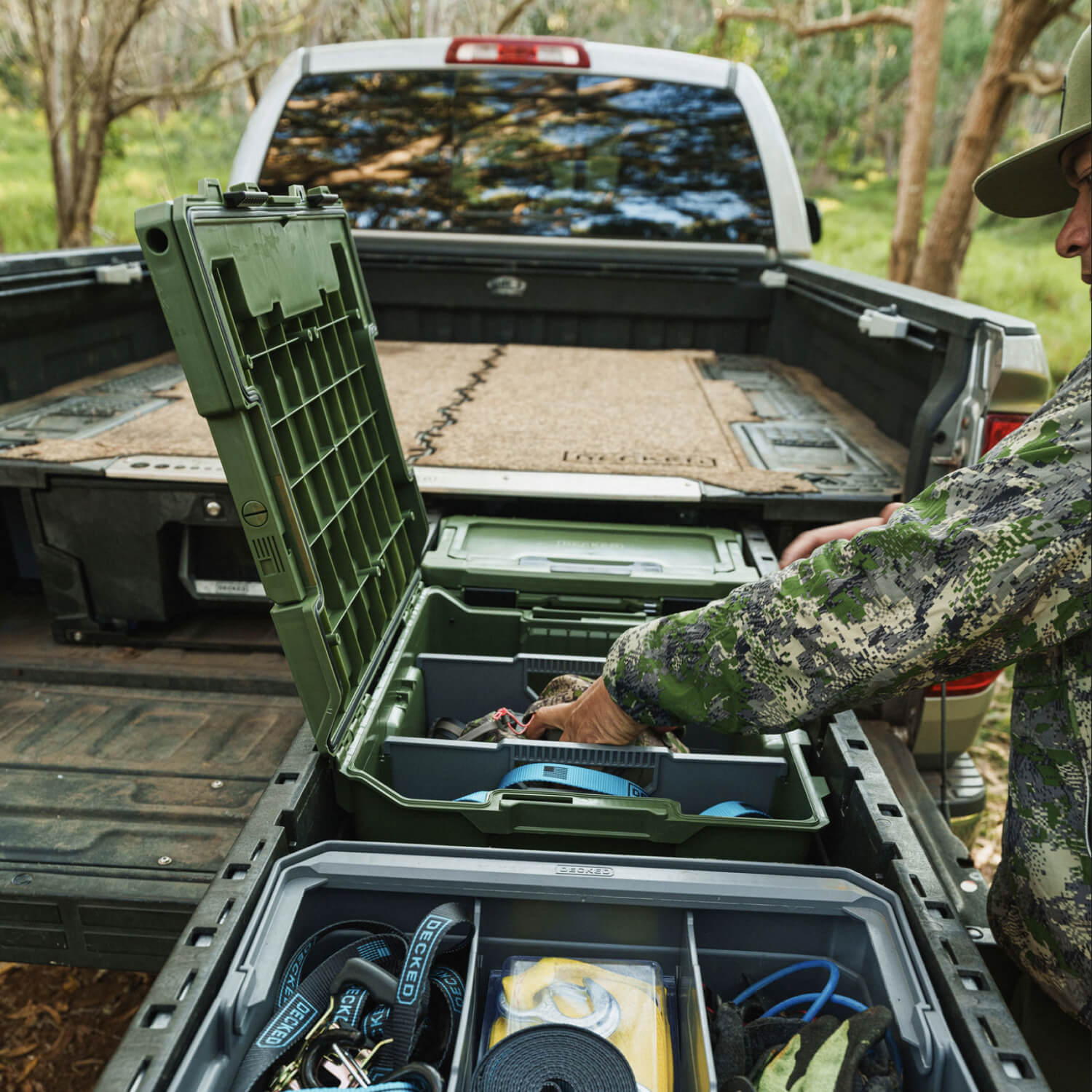 A hunter retrieving his bino harness from his Ranger Green Halfrack 32 stored neatly in his Drawer System.