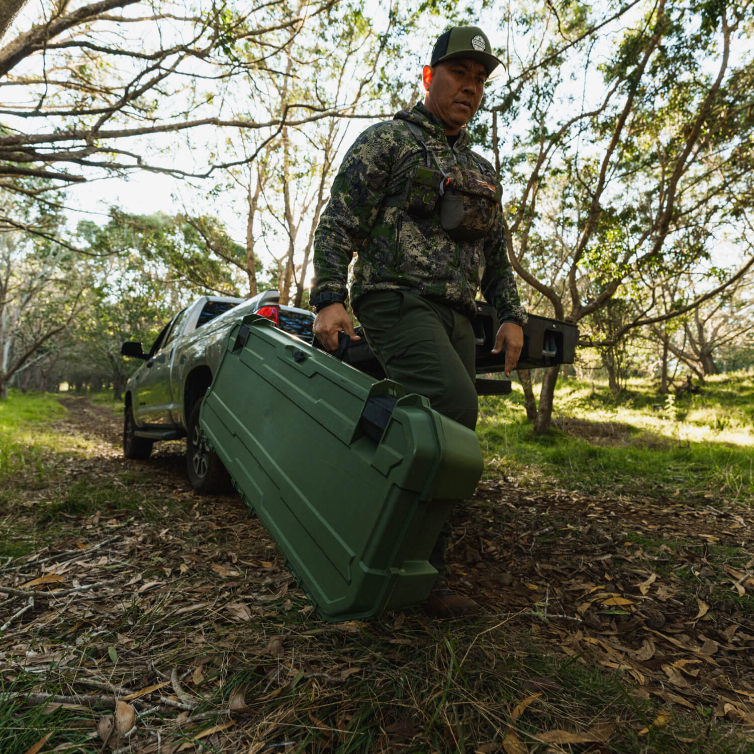 DECKED ambassador, Justin Lee, retrieving his Ranger Green Honcho 80 from his DECKED Drawer System.