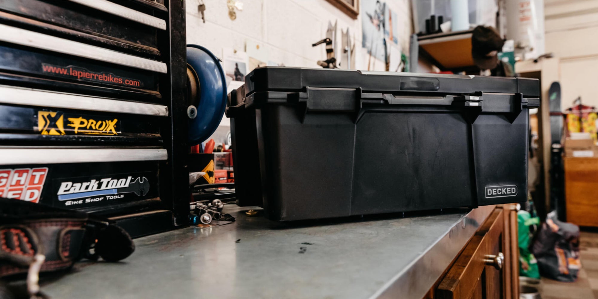 Black sixer sitting on top of a garage workbench.