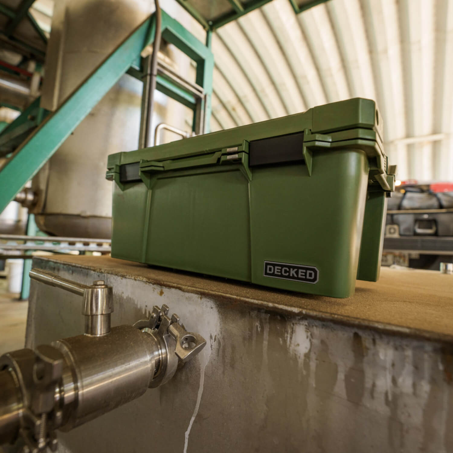 The Ranger Green Sixer in a garage, acting as the perfect storage case for tools, fishing gear, or camping supplies.