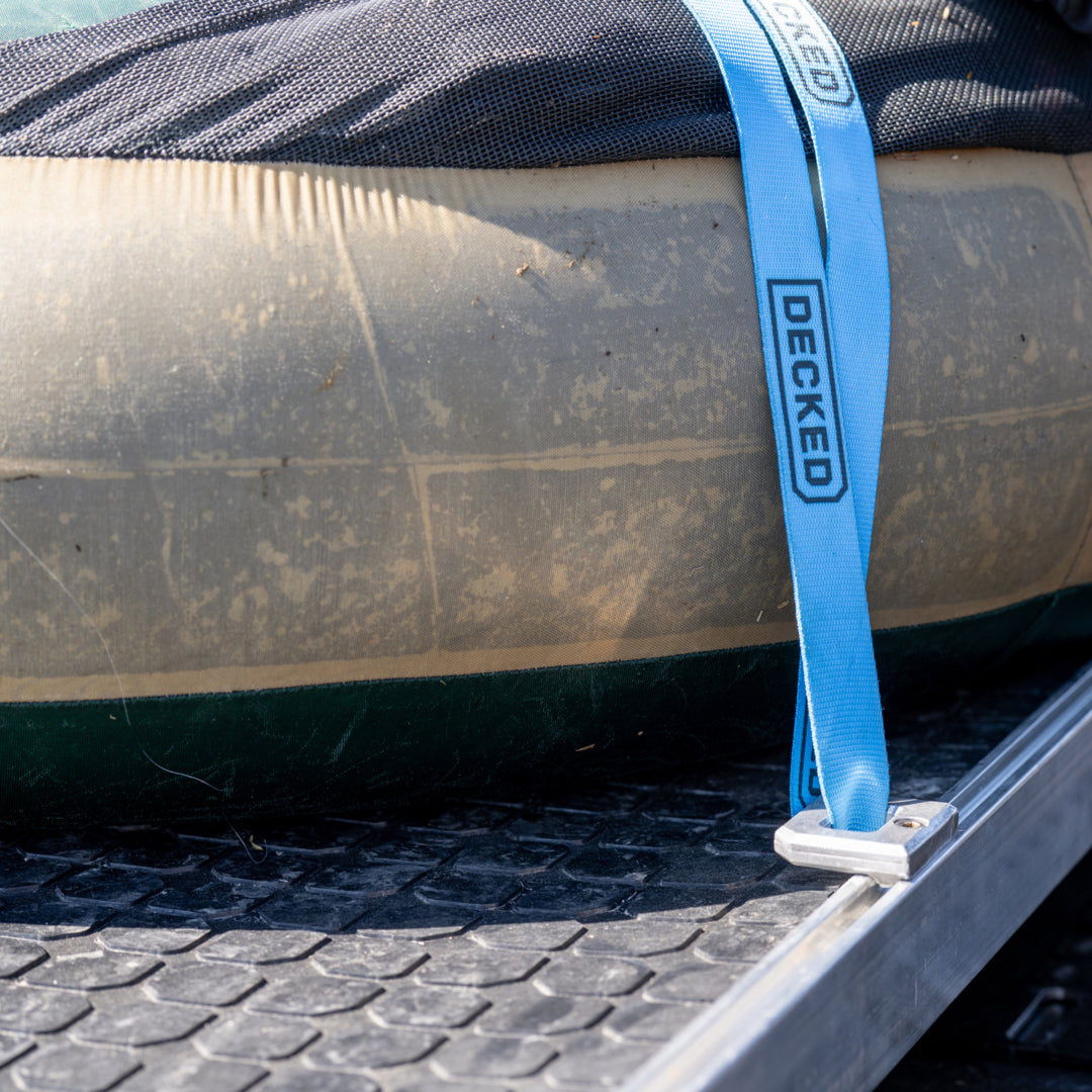 A CargoGlide with Battle Mat and D-rings securing a fisherman's float tube to his CargoGlide.