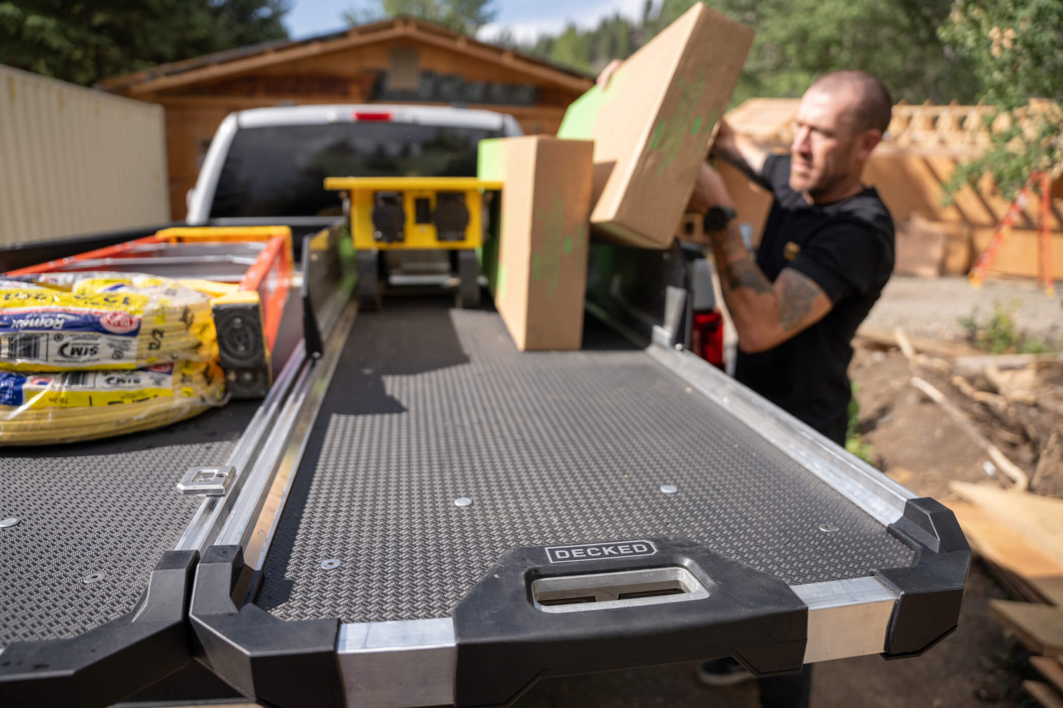 A man loading boxes onto the back of his CargoGlide 600.