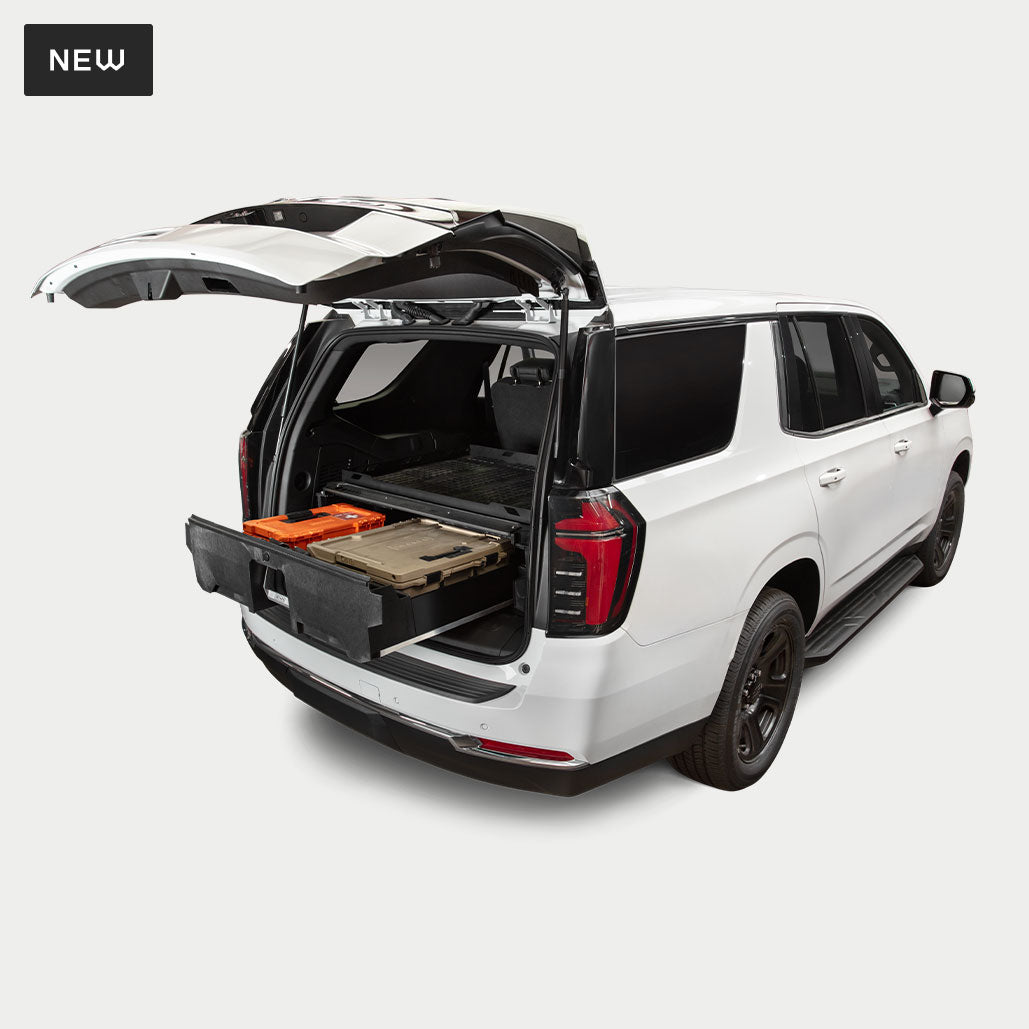 White tahoe SUV studio image showcasing a DECKED drawer system inside.