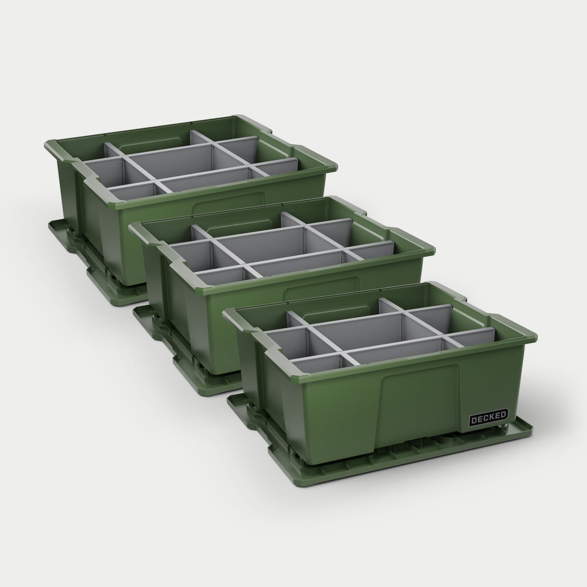 Three green DECKED payloader bins with grey POD divider systems installed in all of them on a white background.