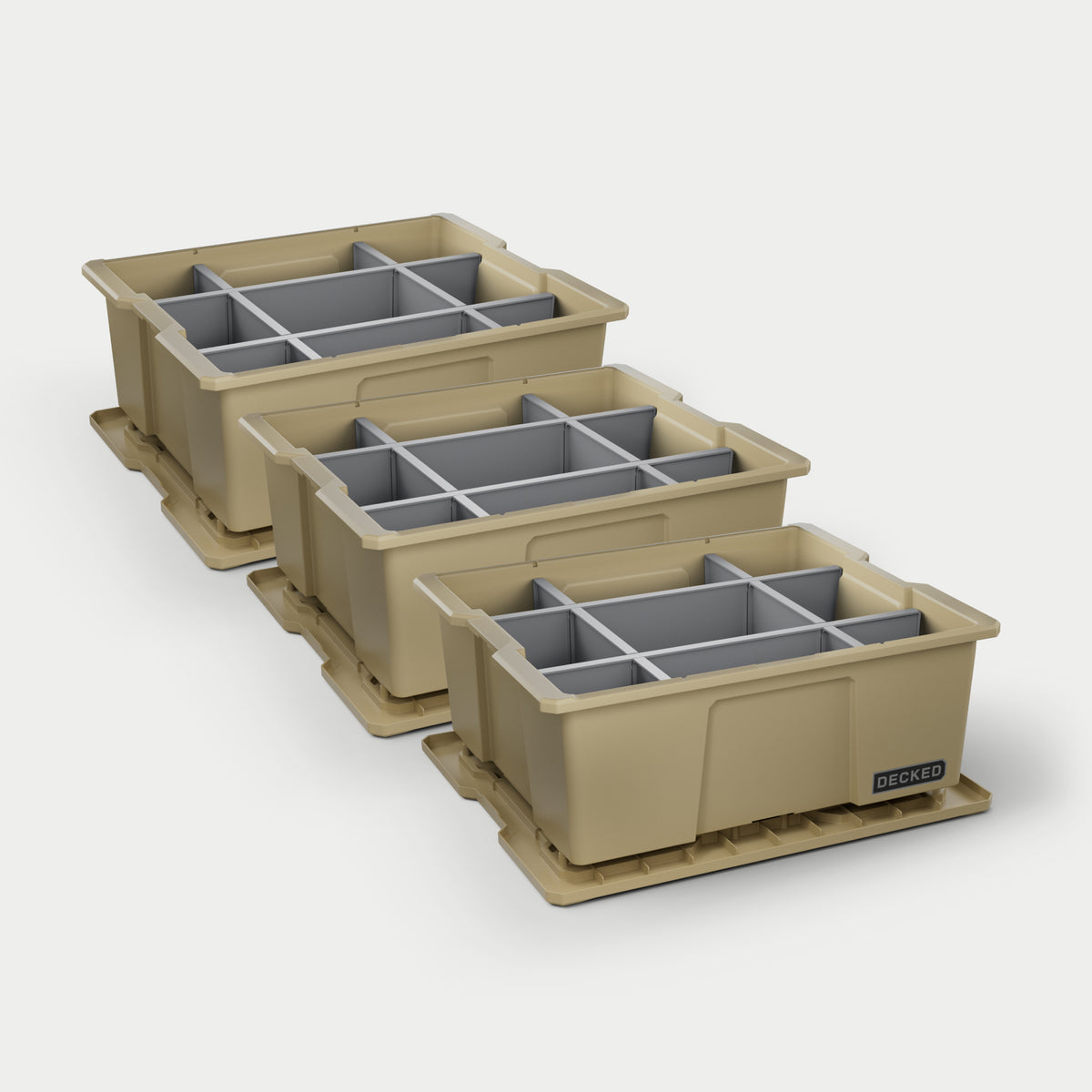 Three tan DECKED payloader bins with grey POD divider systems installed in all of them on a white background.